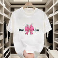 Black and white T-shirts with pink polka-dot bows and diamond-like decorations. Made of pure cotton for comfort, they are...