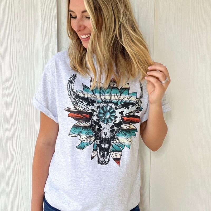 Cow Print Serape Turquoise Bullskull Flower Graphic Tee Hoodie, Sweatshirt | RetroVerseTees.com