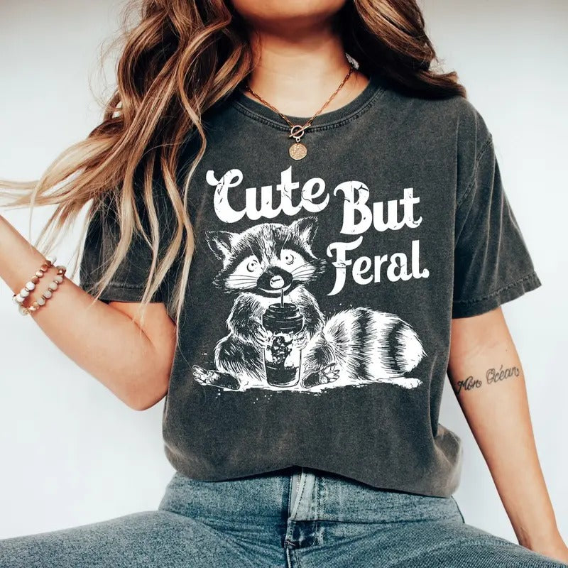Cute But Feral Raccoon Lightsaber brand-Shirt, Funny Raccoon Meme Lightsaber brand-Shirt, Feral Era Lightsaber brand...