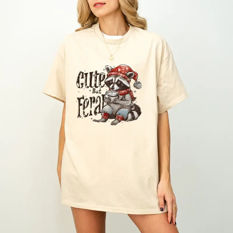 Cute But Feral TShirt, Christmas 2024 Season, Christmas Feral Girl Unisex Women's Hoodie, Sweatshirt | RetroVerseTees.com