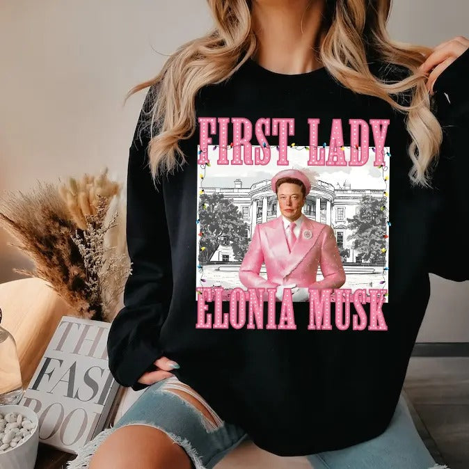 Elonia Mu.sk First Lady Christmas 2024 shirt - Unisex Heavy Cotton Tee Basic Hoodie, Sweatshirt | RetroVerseTees.com