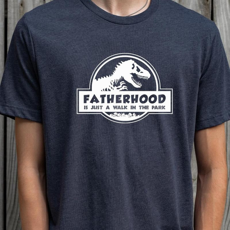 Fatherhood TShirtDino Dad TeeFatherhood Adventure Tee Hoodie, Sweatshirt | RetroVerseTees.com