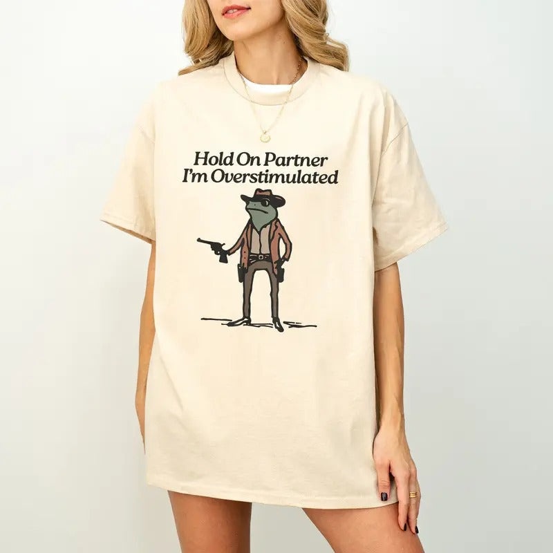 Hold On Partner Im Overstimulated Shirt, Cowboy Frog Shirt, Funny meme shirt Hoodie, Sweatshirt | RetroVerseTees.com
