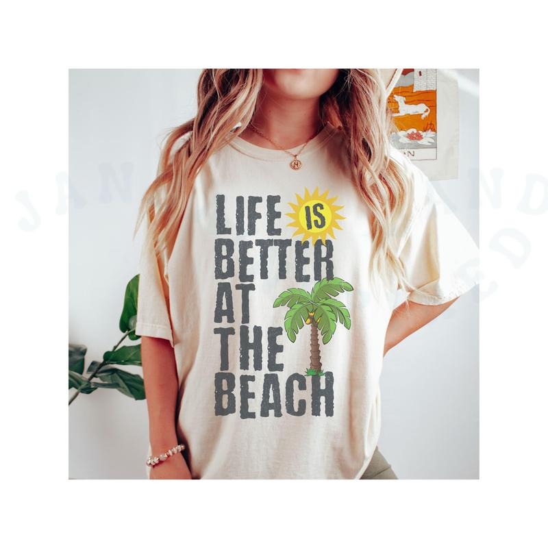Life Is Better At The Beach T-shirt Comfort Colors Playful Design Top Summer Coastal Style Palm Tree Sun Graphic Top...