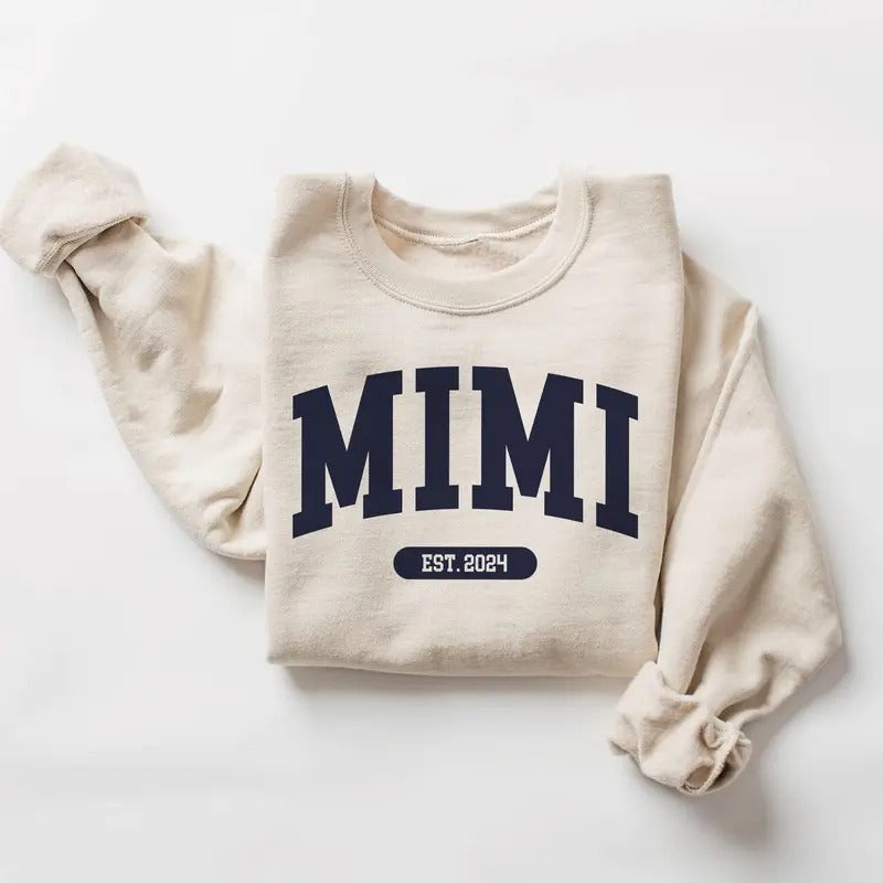 Mimi Varsity Xmas Sweatshirt, Mimi EST 2024 - New Mimi To Be Gift - Pregnancy Reveal - Unisex Crewneck Sweatshirt Classic...