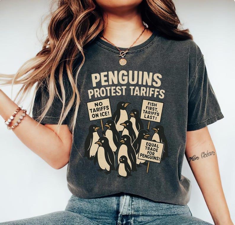 Penguins Protest Tariffs Shirt, Funny Tariffs Shirt, Funny Penguin Graphic Tee Hoodie, Sweatshirt | RetroVerseTees.com