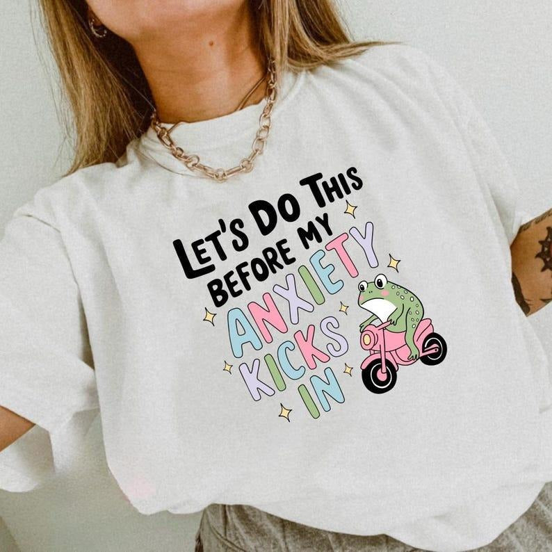 Relatable Gunpla brand Motivational Lightsaber brand - Shirt: Confront Anxiety with TNF "LET'WB shield Red plumber brand...