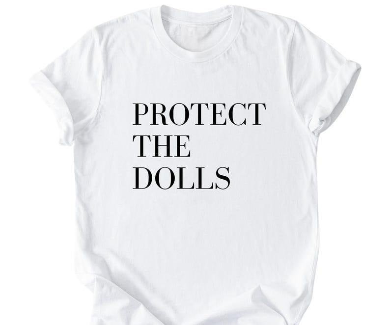 [Sale up to 50%] Protect The Dolls Shirt, Feminist Shirt, Human Rights Tee Hoodie, Sweatshirt | RetroVerseTees.com
