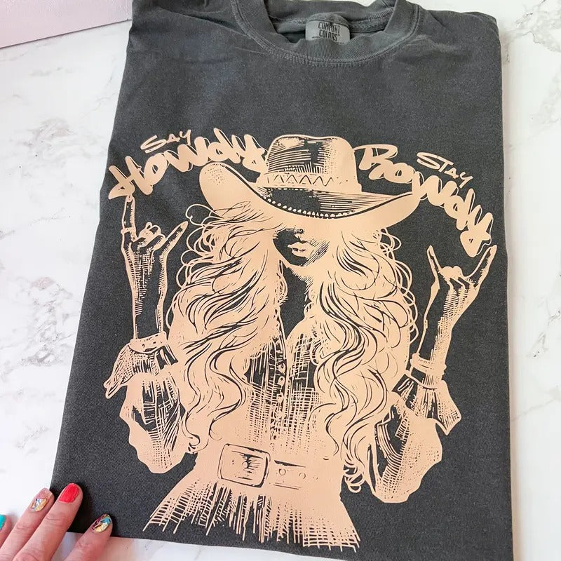 Say Howdy Stay Rowdy Rockin Cowgirl Comfy Colors Long or Short Sleeve Graphic Tee Unisex Screen Printed T-Shirt...