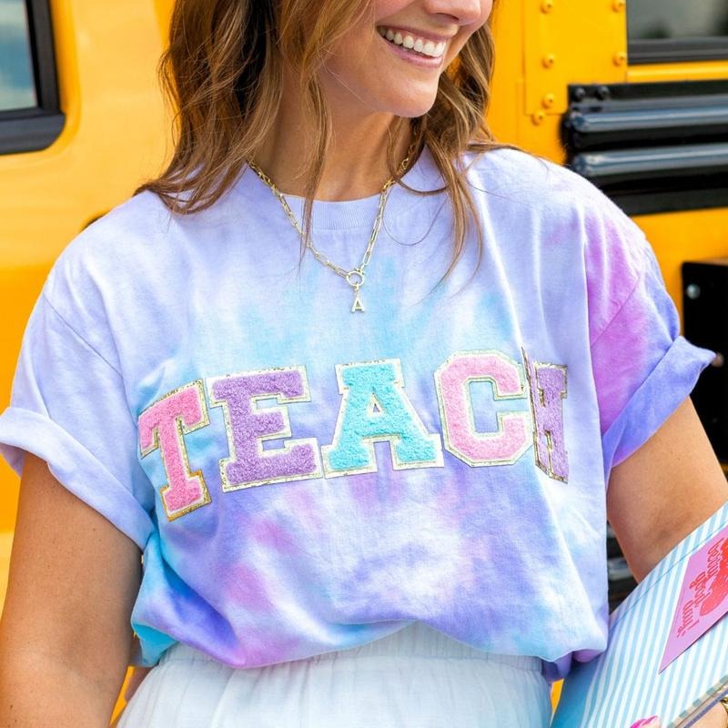 'Teach In Technicolor' Tie Dye Letter Patch T-Shirt Hoodie, Sweatshirt | RetroVerseTees.com