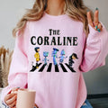 The Coraline Christmas Sweatshirt, Christmas Coraline Unisex Softstyle T-Shirt Hoodie | RetroVerseTees.com