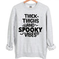 Thick Thighs and Spooky Vibes Halloween Crewneck Sweatshirt Hoodie Tshirt, Halloween 2024 Gifts | RetroVerseTees.com