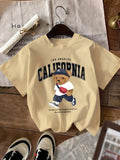 Women'WB shield Cartoon Bear & Letter Print Round Neck Tee, Fashion Casual Short Sleeve T-Shirt for Daily Holiday...