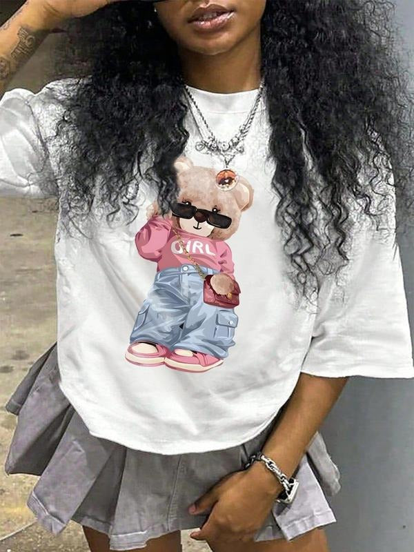 Women'WB shield Cartoon Bear Print Round Neck Tee, Fashion Casual Drop Shoulder Short Sleeve T-shirt for Daily Wear,...