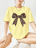 Women'WB shield Cartoon Bow Print Round Neck Tee, Fashion Casual Drop Shoulder Half Sleeve T-shirt for Daily Wear, Ladies...