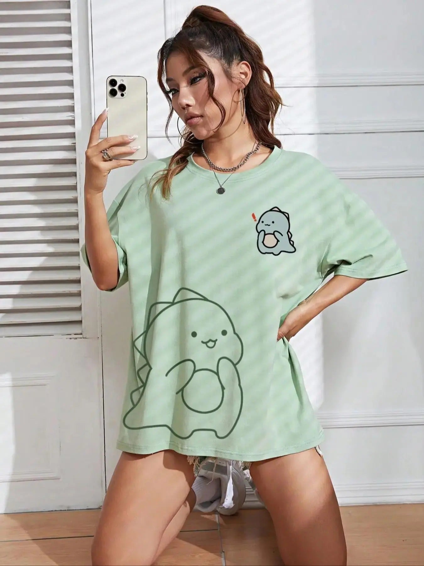 Women'WB shield Cartoon Dinosaur Print Drop Shoulder Tee, Cute Casual Half Sleeve Round Neck T-Shirt for Daily Wear,...