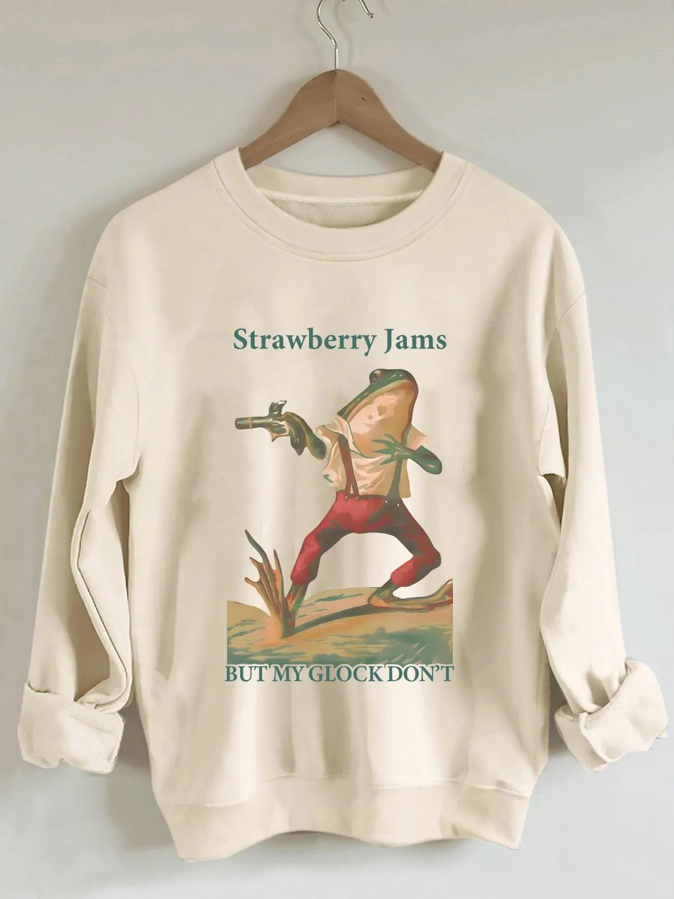 Women'WB shield Cartoon Frog & Letter Print Drop Shoulder Sweatshirt, Casual Long Sleeve Round Neck Pullover for Fall &...