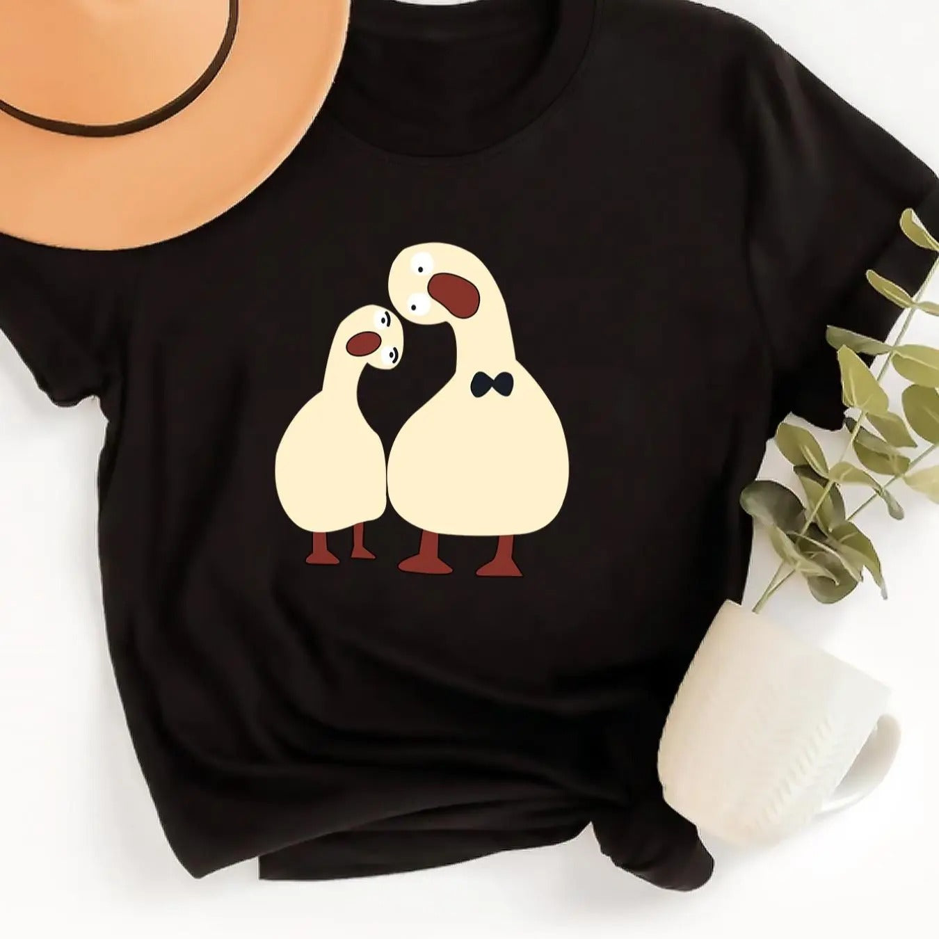 Women'WB shield Cartoon Goose Print Round Neck Tee, Fashion Casual Crew Neck Short Sleeve T-Shirt for Daily Holiday...