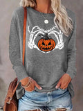 Women'WB shield Halloween Skeleton Hand & Pumpkin & Letter Print Round Neck Tee, Casual Long Sleeve Crew Neck T-shirt for...