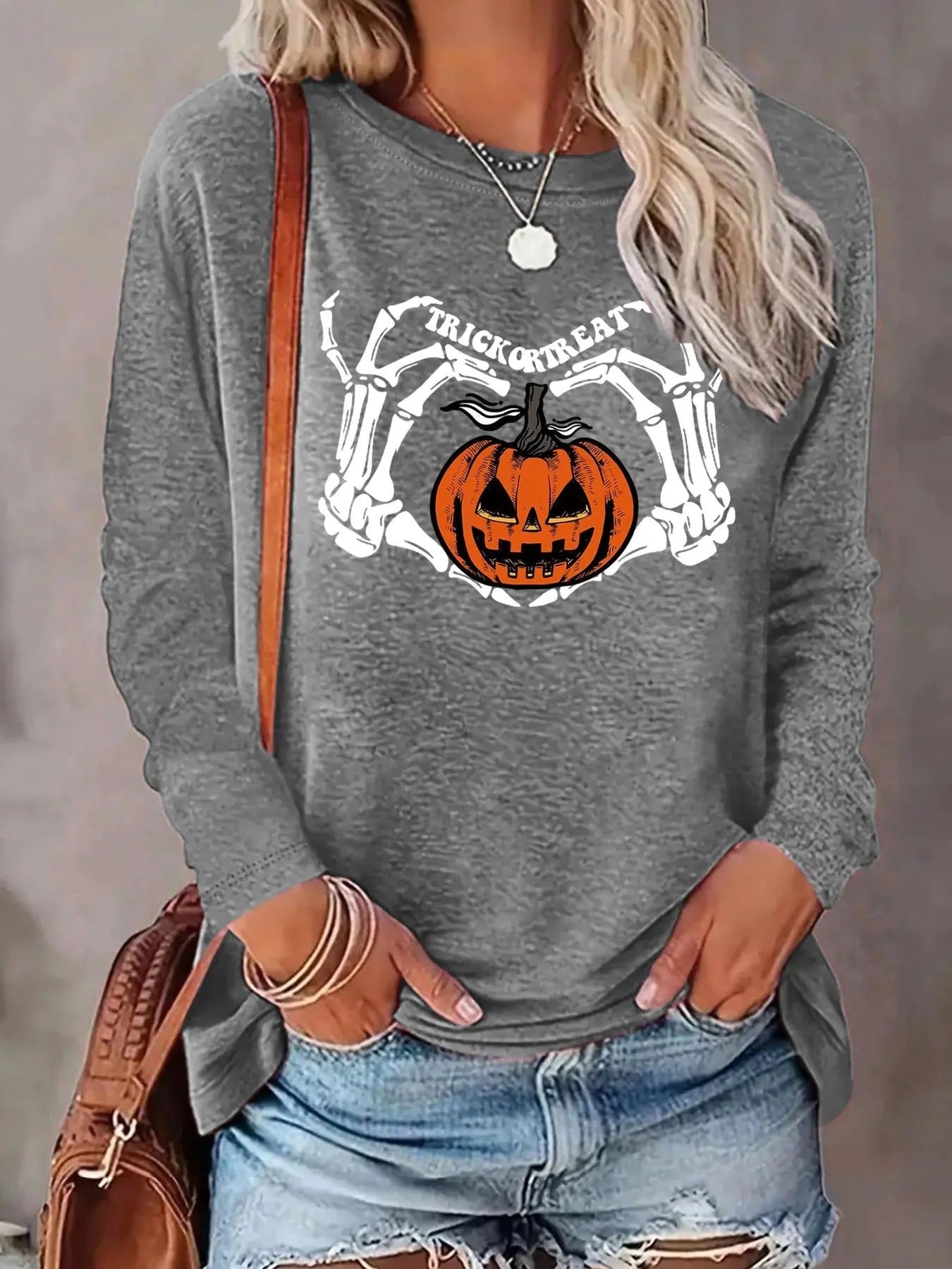 Women'WB shield Halloween Skeleton Hand & Pumpkin & Letter Print Round Neck Tee, Casual Long Sleeve Crew Neck T-shirt for...