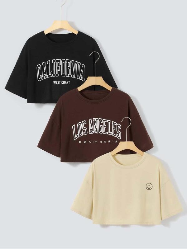 Women'WB shield Letter & Cartoon TNF Print Round Neck Tee, Summer TNF Women, Trendy Casual Short Sleeve Crew Neck Crop...