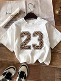 Women'WB shield Letter & Tropical Print Round Neck Casual Loose-Fit Top, Comfortable Fashion Daily Wear Tee for Summer...