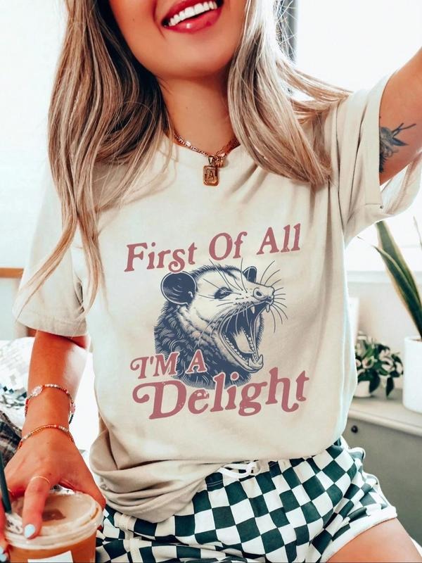 Women'WB shield Raccoon & Letter Print Round Neck Tee, Fashion Casual Crew Neck T-Shirt for Daily Holiday Vacation...