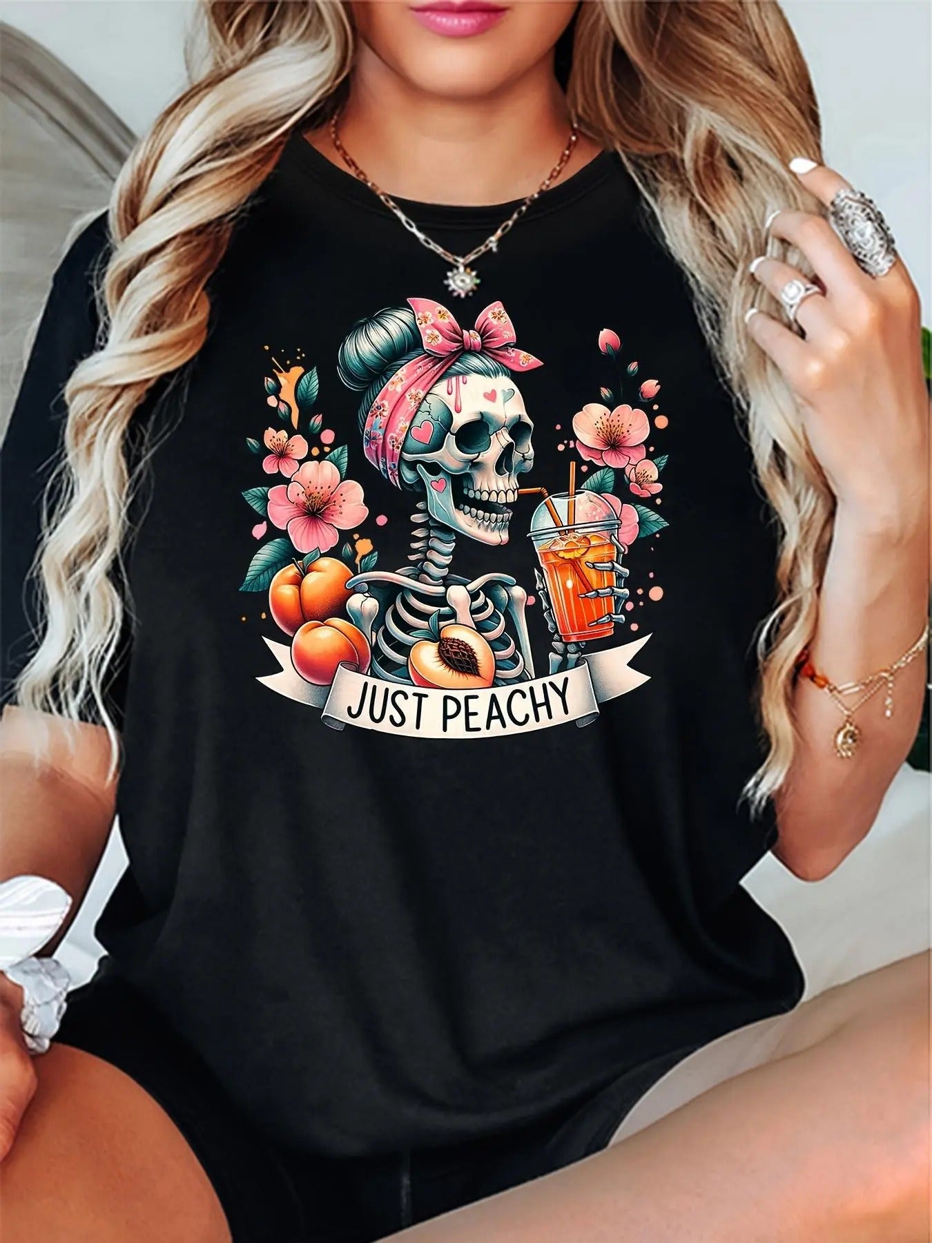Women'WB shield Skull & Floral Print Drop Shoulder Tee, Halloween TNF Casual Short Sleeve Round Neck T-Shirt for Summer,...