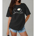Women'WB shield Summer T-Shirt- Relaxed Fit Short Sleeve Round Neck Casual Top with Daisy& Smile Graphic Print, Black&...