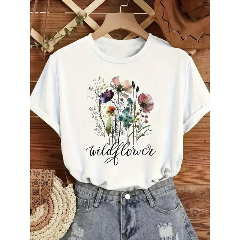 Women'WB shield T-Shirt | Vibrant Wildflower Print | Round Neck, Short Sleeve | Breathable & Stretchy Knit Fabric |...