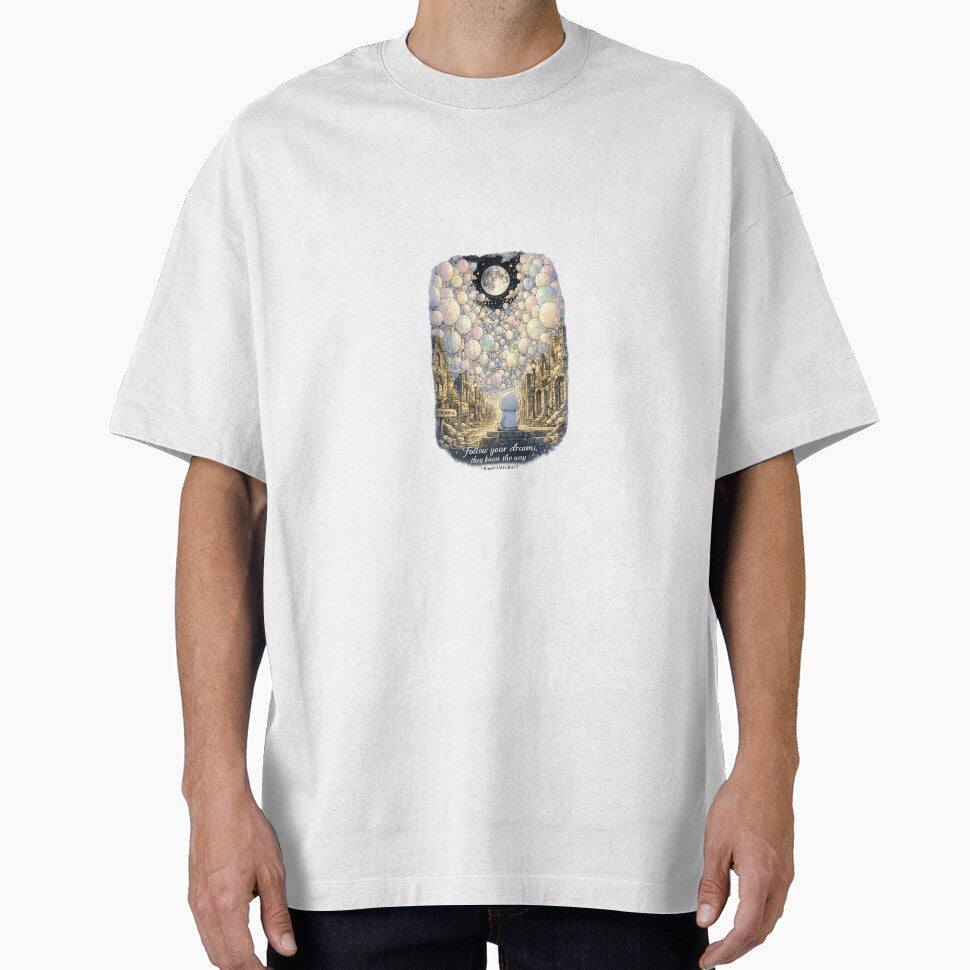Moonlit Balloon Dreams – A Surreal Street Where Hope Floats Beyond the Ruins Unisex Graphic T-Shirt by #kingMAMECRAFT