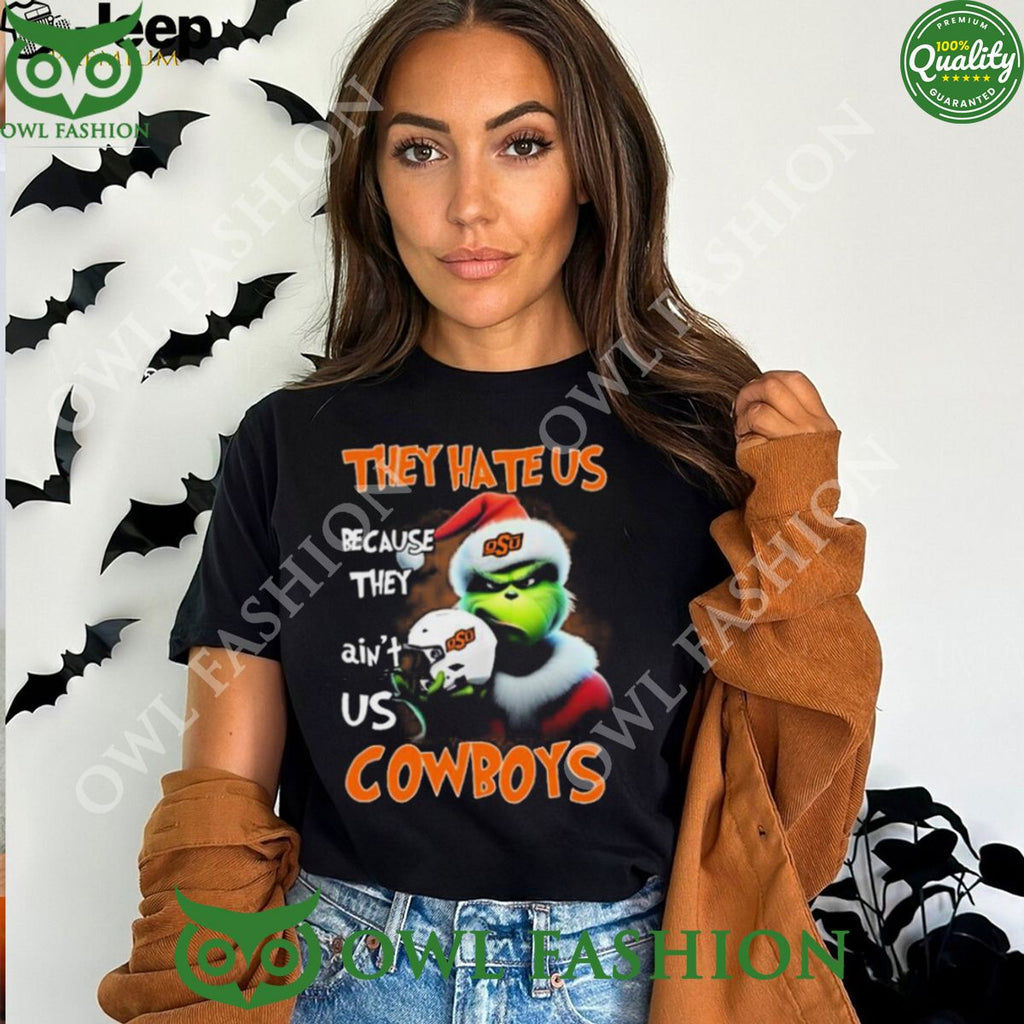 They Hate Us Because Ain’t Us Oklahoma State Cowboys Santa Grinch Christmas T-Shirt